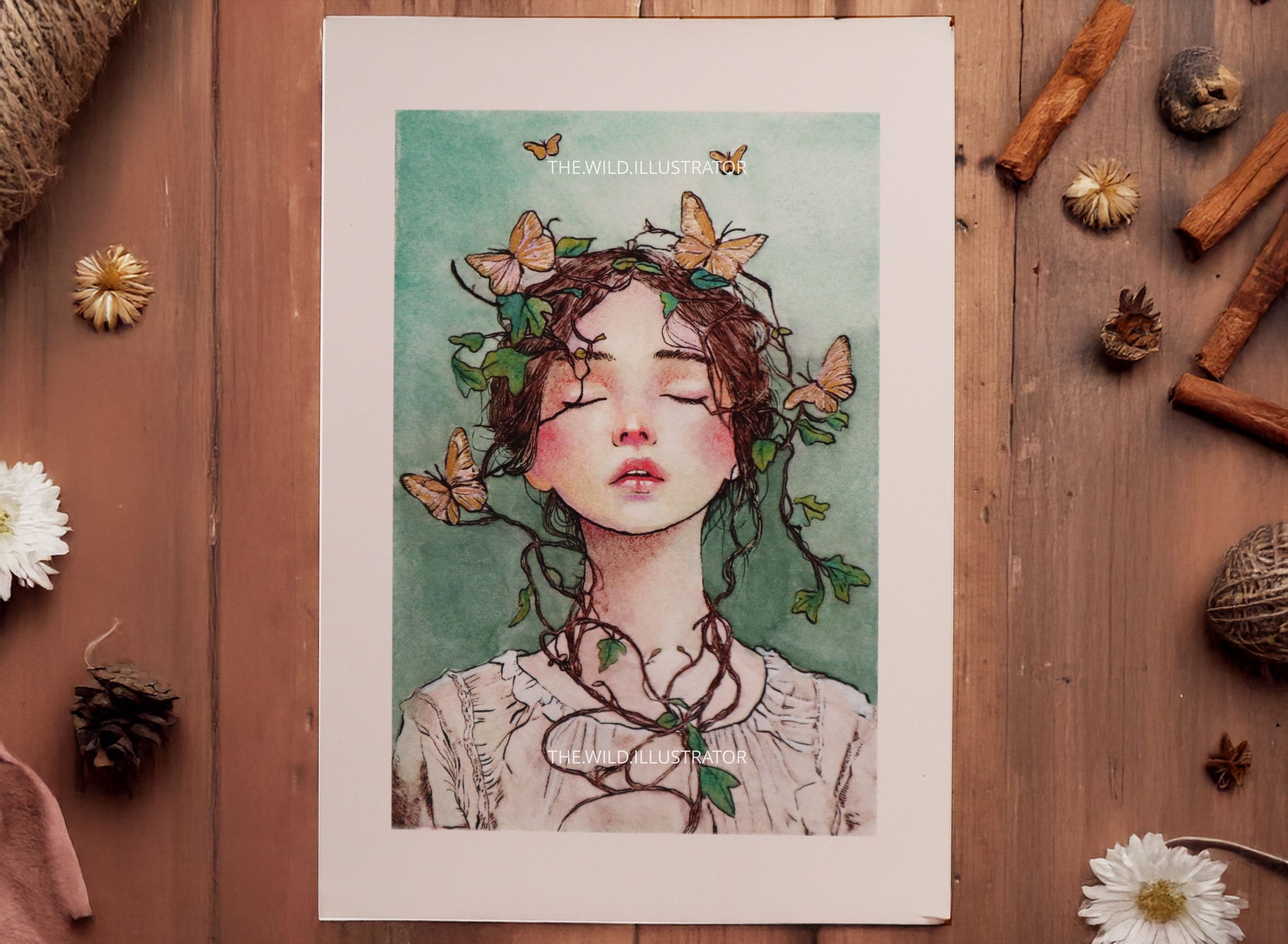 Art print of a woman with vines and golden butterflies in pastel tones, printed on fine art paper. Optional hand-embellished gold accents available, shown in A4 size.