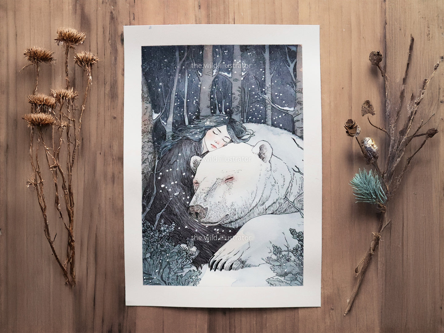 Winter Dreams original watercolor painting featuring polar bear and woman in snowy forest.