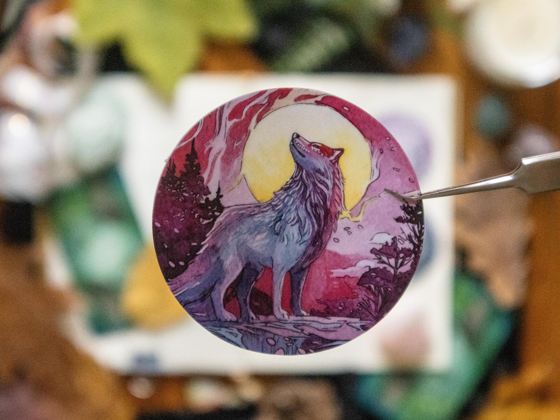 Close-up of Full Moon sticker with wolf.